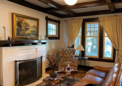 Photo of a living room with white painted fireplace