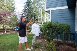 Photo of kind home painters outside